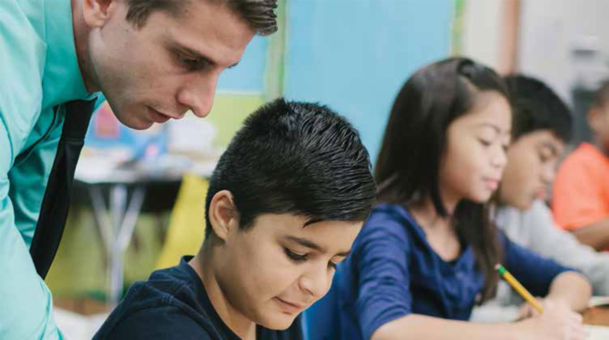 Teacher helping a student